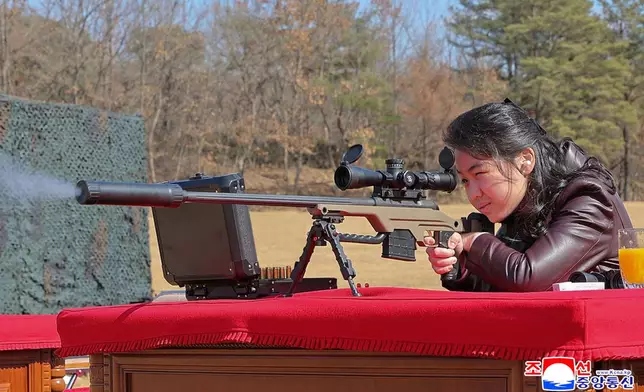 In this photo provided by the North Korean government, the daughter of its leader Kim Jong Un test-fires a new sniper rifle at a shooting range in an undisclosed location, North Korea Friday, Feb. 27, 2026. Independent journalists were not given access to cover the event depicted in this image distributed by the North Korean government. The content of this image is as provided and cannot be independently verified. Korean language watermark on image as provided by source reads: "KCNA" which is the abbreviation for Korean Central News Agency. (Korean Central News Agency/Korea News Service via AP) ２７日、新型狙撃銃で射撃を行う金正恩朝鮮労働党総書記の娘