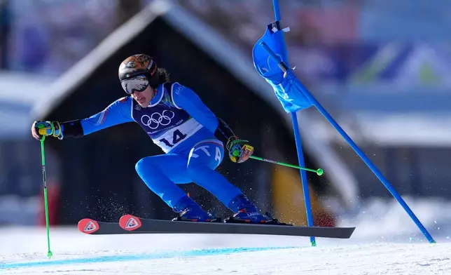 Italy's Federica Brignone speeds down the course, during an alpine ski, women's giant slalom race, at the 2026 Winter Olympics, in Cortina d'Ampezzo, Italy, Sunday, Feb. 15, 2026. (AP Photo/Robert F. Bukaty)