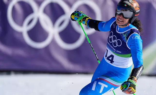 Italy's Federica Brignone celebrates winning an alpine ski, women's giant slalom race, at the 2026 Winter Olympics, in Cortina d'Ampezzo, Italy, Sunday, Feb. 15, 2026.(AP Photo/Robert F. Bukaty)
