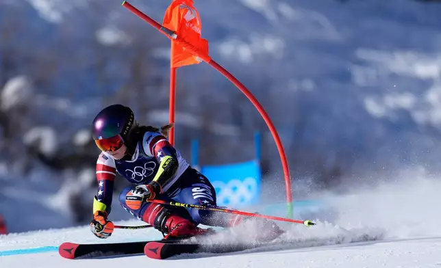 United States' Mikaela Shiffrin speeds down the course, during an alpine ski, women's giant slalom race, at the 2026 Winter Olympics, in Cortina d'Ampezzo, Italy, Sunday, Feb. 15, 2026. (AP Photo/Robert F. Bukaty)