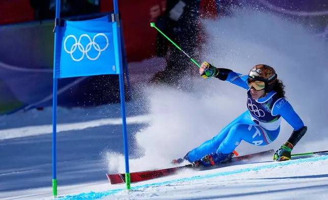 Italy's Federica Brignone speeds down the course, during an alpine ski, women's giant slalom race, at the 2026 Winter Olympics, in Cortina d'Ampezzo, Italy, Sunday, Feb. 15, 2026. (AP Photo/Robert F. Bukaty)