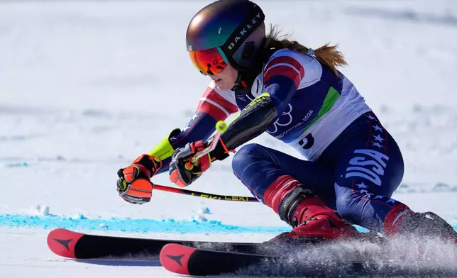 United States' Mikaela Shiffrin speeds down the course, during an alpine ski, women's giant slalom race, at the 2026 Winter Olympics, in Cortina d'Ampezzo, Italy, Sunday, Feb. 15, 2026. (AP Photo/Robert F. Bukaty)