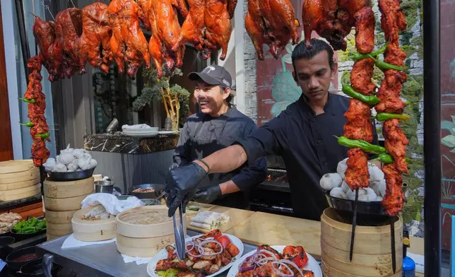 Chicken tikka is served at the South Beach Wine and Food Festival Friday, Feb. 20, 2026, in Miami Beach, Fla. (AP Photo/Marta Lavandier)