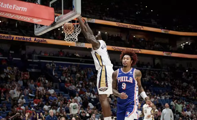 New Orleans Pelicans forward Zion Williamson (1) dunks against Philadelphia 76ers guard Kelly Oubre Jr. (9) during the first half of an NBA basketball game in New Orleans, Saturday, Feb. 21, 2026. (AP Photo/Matthew Hinton)
