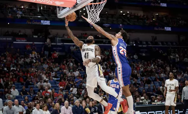New Orleans Pelicans guard Saddiq Bey (41) shoots against Philadelphia 76ers forward Dominick Barlow (25) during the first half of an NBA basketball game in New Orleans, Saturday, Feb. 21, 2026. (AP Photo/Matthew Hinton)