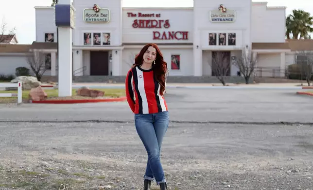 CORRECTS TO WYLDER, NOT WILDER - A sex worker, who goes by the name Molly Wylder, poses for a photo in front of Sheri's Ranch, a brothel In Pahrump, Nev. on Thursday, Feb. 12, 2026. (AP Photo/Ian Maule)