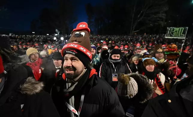 A crowd waits for Punxsutawney Phil, the weather prognosticating groundhog, to come out and make his prediction during the 140th celebration of Groundhog Day on Gobbler's Knob in Punxsutawney, Pa., Monday, Feb. 2, 2026. (AP Photo/Barry Reeger)