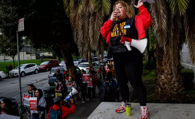 English and Physical Education teacher Alison White leads a chant as teachers and San Francisco Unified School District staff join a city-wide protest to demand a fair contract at Mission High School, Monday, Feb. 9, 2026, in San Francisco. (Brontë Wittpenn/San Francisco Chronicle via AP)