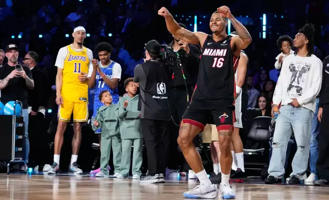 Miami Heat forward Keshad Johnson celebrates after dunking during the slam dunk contest at the NBA basketball All-Star weekend festivities Saturday, Feb. 14, 2026, in Inglewood, Calif. (AP Photo/Mark J. Terrill)