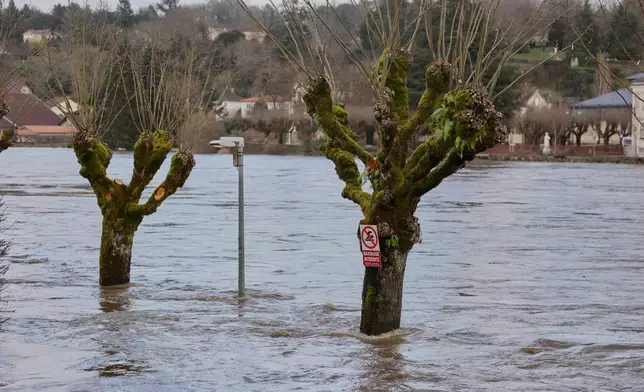 Flooded roads are seen as severe flooding hits western France amid storm Nils, in Confolens, western France, Thursday, Feb. 12, 2026. (AP Photo/Yohan Bonnet)