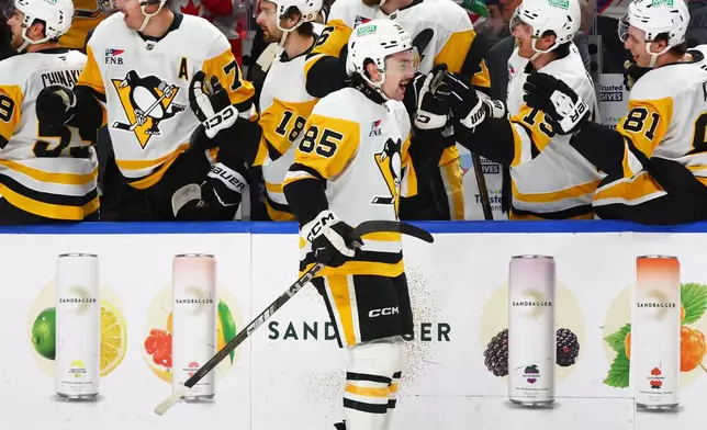 Pittsburgh Penguins forward Avery Hayes (85) celebrates his goal during the first period of an NHL hockey game against the Buffalo Sabres Thursday, Feb. 5, 2026, in Buffalo, N.Y. (AP Photo/Jeffrey T. Barnes)