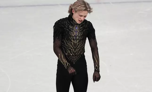 Ilia Malinin of the United States reacts at the end of his program after competing during the men's free skate program in figure skating at the 2026 Winter Olympics, in Milan, Italy, Friday, Feb. 13, 2026. (AP Photo/Francisco Seco)