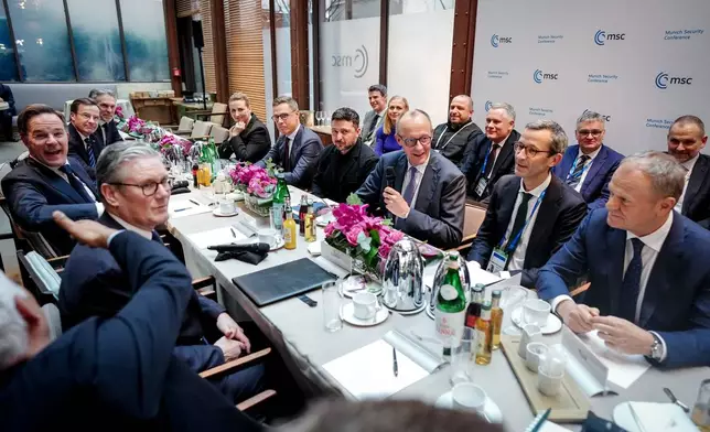 From left, Secretary General of NATO Mark Rutte, Britain's Prime Minister Keir Starmer, Prime Minister of Sweden Ulf Kristersson, Prime Minister of the Netherlands Dick Schoof, Prime Minister of Denmark Mette Frederiksen, President of Finland Alexander Stubb, Ukrainian President Volodymyr Zelenskyy, German Chancellor Friedrich Merz, Günter Sautter Foreign and Security Policy Advisor to the Chancellor, Prime Minister of Poland attend a meeting at the Munich Security Conference in Munich, Germany, Friday Feb. 13, 2026. (Kay Nietfeld/Pool via AP)