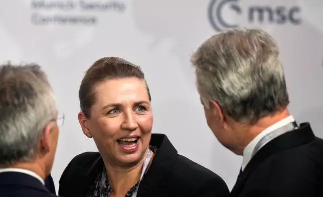 From left, Norway's Finance Minister Jens Stoltenberg, Denmark's Prime Minister Mette Frederiksen and Lithuania's President Gitanas Nauseda speak prior to a panel discussion during the Munich Security Conference in Munich, Germany, Friday, Feb. 13, 2026. (AP Photo/Michael Probst)
