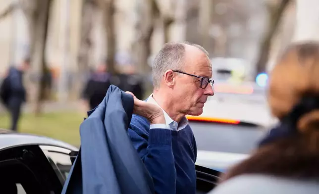Germany's Chancellor Friedrich Merz arrives for the Munich Security Conference in Munich, Germany, Friday, Feb. 13, 2026. (AP Photo/Michael Probst)