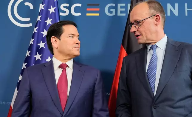 U.S. Secretary of State Marco Rubio, left, and Germany's Chancellor Friedrich Merz meet in Munich, Germany, Friday, Feb. 13, 2026, at the Munich Security Conference. (AP Photo/Alex Brandon, Pool)