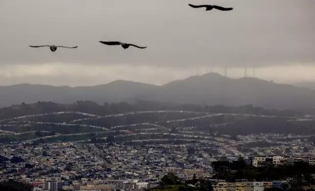 Storm clouds bring rain to the Bay Area, in San Francisco, Sunday, Feb. 15, 2026. (Brontë Wittpenn/San Francisco Chronicle via AP)