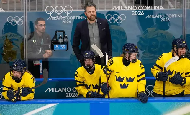 Sweden's Head Coach Ulf Lundberg gestures during a preliminary round match of women's ice hockey between France and Sweden at the 2026 Winter Olympics, in Milan, Italy, Sunday, Feb. 8, 2026. (AP Photo/Petr David Josek)