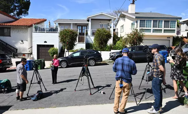 Media stage outside the home of Los Angeles Unified School District Superintendent Alberto Carvalho on Wednesday, Feb. 25, 2026, in San Pedro, Calif. (AP Photo/William Liang)