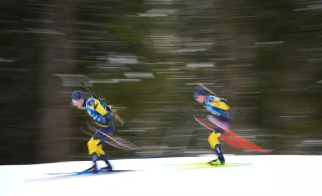 Athletes from Sweden participate in a biathlon training session at the 2026 Winter Olympics in Anterselva, Italy, Saturday, Feb. 7, 2026. (AP Photo/Andrew Medichini)
