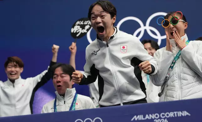 Yuma Kagiyama of Japan reacts to his scores after competing during the figure skating men's team event at the 2026 Winter Olympics, in Milan, Italy, Saturday, Feb. 7, 2026. (AP Photo/Francisco Seco)