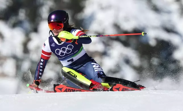United States' Mikaela Shiffrin speeds down the course during an alpine ski, women's slalom race, at the 2026 Winter Olympics, in Cortina d'Ampezzo, Italy, Wednesday, Feb. 18, 2026. (AP Photo/Marco Trovati)