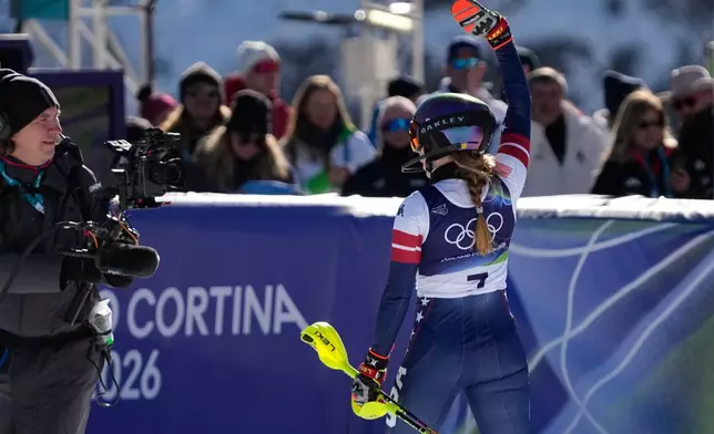 United States' Mikaela Shiffrin at the finish area of an alpine ski, women's slalom race, at the 2026 Winter Olympics, in Cortina d'Ampezzo, Italy, Wednesday, Feb. 18, 2026. (AP Photo/Andy Wong)