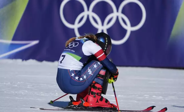 United States' Mikaela Shiffrin celebrates at the finish area of an alpine ski, women's slalom race, at the 2026 Winter Olympics, in Cortina d'Ampezzo, Italy, Wednesday, Feb. 18, 2026. (AP Photo/Jacquelyn Martin)