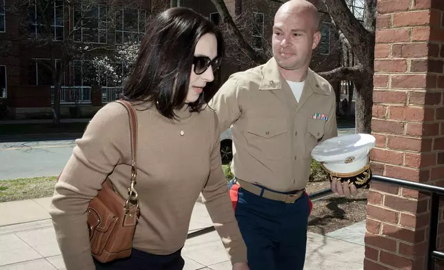 FILE - Marine Maj. Joshua Mast and his wife, Stephanie, arrive at Circuit Court, Thursday, March 30, 2023 in Charlottesville, Va. (AP Photo/Cliff Owen, File)
