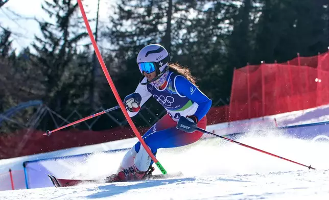 Philippine's Tallulah Proulx speeds down the course during an alpine ski, women's slalom race, at the 2026 Winter Olympics, in Cortina d'Ampezzo, Italy, Wednesday, Feb. 18, 2026. (AP Photo/Robert F. Bukaty)