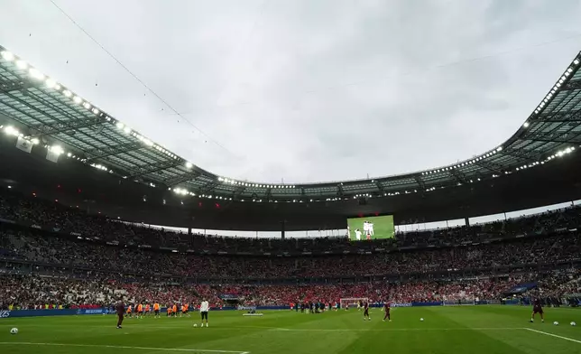 FILE - Players of Paris Saint-Germain and Reims warm up prior to the French Cup soccer final at the Stade de France stadium in Saint-Denis, outside Paris, Saturday May 24, 2025. (AP Photo/Aurelien Morissard, file)