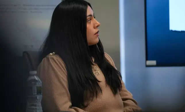 Marimar Martinez, a woman who was shot by a Border Patrol agent last year, sits with her attorneys during a press conference Wednesday, Feb. 11, 2026, in Chicago. (AP Photo/Erin Hooley)