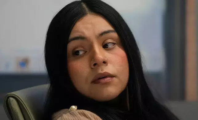 Marimar Martinez, a woman who was shot by a Border Patrol agent last year, sits with her attorneys during a press conference Wednesday, Feb. 11, 2026, in Chicago. (AP Photo/Erin Hooley)