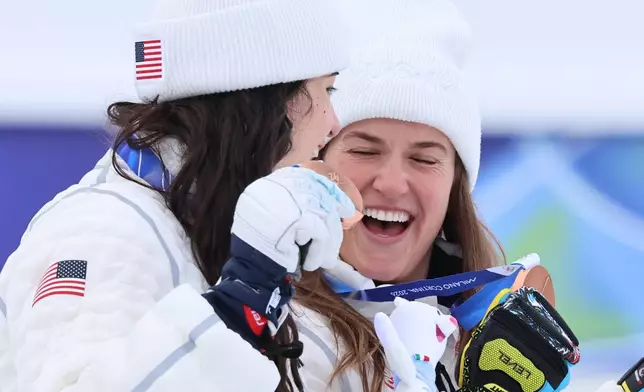 United States' Jacqueline Wiles, left, and Paula Moltzen pose with their bronze medals of a women's team combined race, at the 2026 Winter Olympics, in Cortina d'Ampezzo, Italy, Tuesday, Feb. 10, 2026. (AP Photo/Marco Trovati)