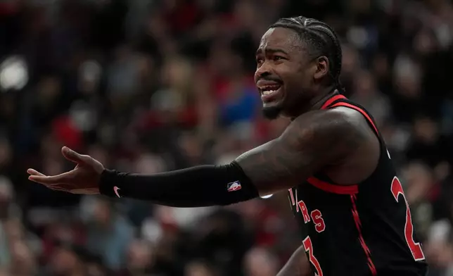 Toronto Raptors guard Jamal Shead reacts to a foul called against him during the first half of an NBA basketball game against the Chicago Bulls, Thursday, Feb. 19, 2026, in Chicago. (AP Photo/Erin Hooley)