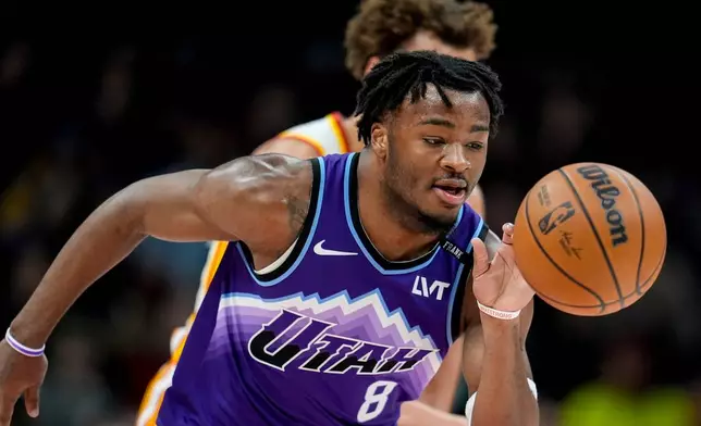 Utah Jazz guard Isaiah Collier (8) moves the ball against the Atlanta Hawks during the first half of an NBA basketball game, Thursday, Feb. 5, 2026, in Atlanta. (AP Photo/Mike Stewart)