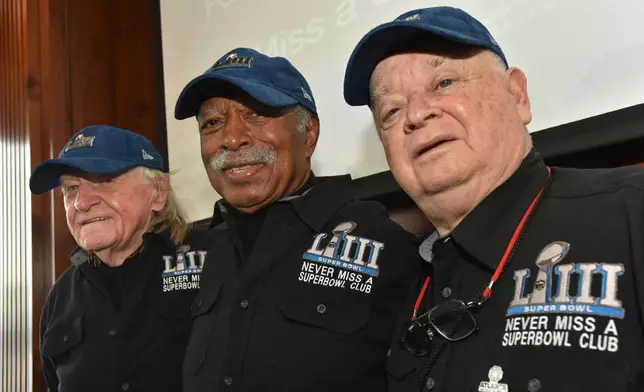 FILE — Members of the Never Miss a Super Bowl Club, from the left, Tom Henschel, Gregory Eaton, and Don Crisman pose for a group photograph during a welcome luncheon, in Atlanta, Feb. 1, 2019. (Hyosub Shin/Atlanta Journal-Constitution via AP, File)
