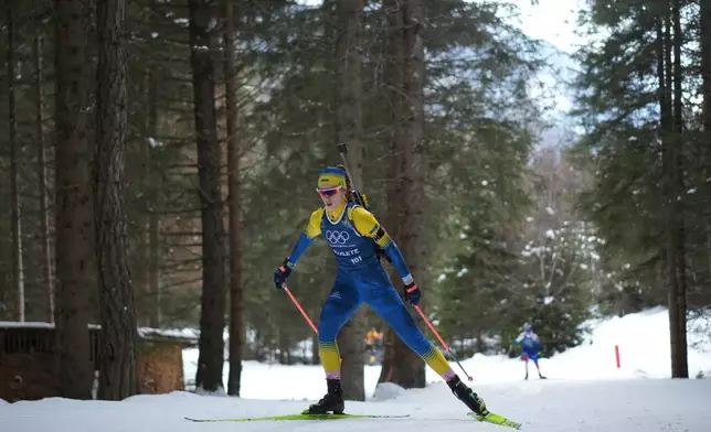 Khrystyna Dmytrenko, of Ukraine, skis during a biathlon training session at the 2026 Winter Olympics in Anterselva, Italy, Monday, Feb. 9, 2026. (AP Photo/Andrew Medichini)