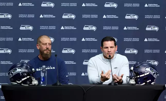 Seattle Seahawks new offensive coordinator Brian Fleury, left, and head coach Mike Macdonald answer questions during a press conference at the NFL football team's headquarters, Thursday, Feb. 19, 2026, in Renton, Wash. (AP Photo/John Froschauer)