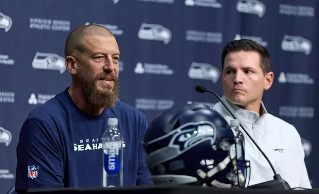 Seattle Seahawks new offensive coordinator Brian Fleury, left, and head coach Mike Macdonald answer questions during a press conference at the NFL football team's headquarters, Thursday, Feb. 19, 2026, in Renton, Wash. (AP Photo/John Froschauer)