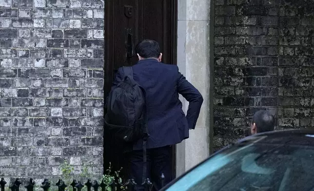 A person enters the home of Lord Peter Mandelson in north west London, Friday, Feb. 6, 2026. (Maja Smiejkowska/PA via AP)