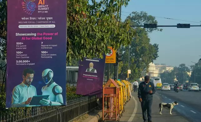 Banners of AI-Summit with Indian Prime Minister Narendra Modi stand beside a road leading to summit venue in New Delhi, India, Monday, Feb. 16, 2026. (AP Photo/Manish Swarup)