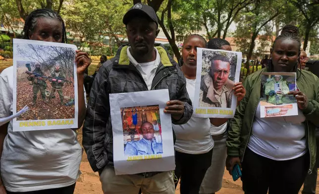 Family members of Kenyans who joined the Russian army in Ukraine hold photos of their loved ones during a protest calling on the government to urgently repatriate them and their remains in Nairobi, Thursday, Feb. 19, 2026. (AP Photo/Andrew Kasuku)