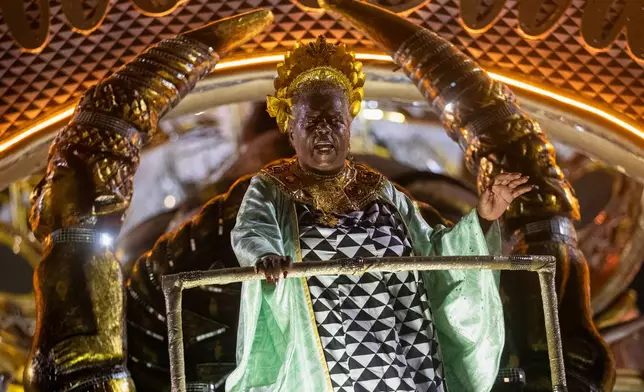 Brazilian writer Conceicao Evaristo is honored by the Imperio Serrano samba school during Carnival celebrations at the Sambadrome in Rio de Janeiro, early Sunday, Feb. 15, 2026. (AP Photo/Bruna Prado)