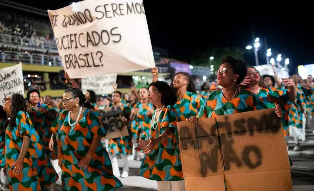 Performers from the Unidos da Tijuca samba school parade during Carnival celebrations at the Sambadrome in Rio de Janeiro, early Tuesday, Feb. 17, 2026. (AP Photo/Bruna Prado)