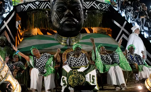 Performers from the Imperio Serrano samba school parade on a float during Carnival celebrations at the Sambadrome in Rio de Janeiro, early Sunday, Feb. 15, 2026. (AP Photo/Bruna Prado)