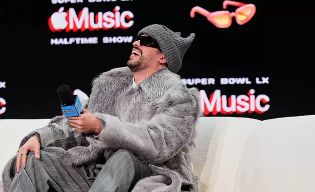 Apple Music Super Bowl LX Halftime Show performer Bad Bunny laughs during a news conference, Thursday, Feb. 5, 2026, in San Francisco ahead of the NFL Super Bowl 60 football game between the Seattle Seahawks and the New England Patriots. (AP Photo/Godofredo A. Vásquez)