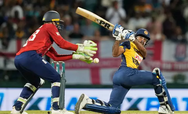 Sri Lanka's Pavan Rathnayake plays a shot during the second T20 cricket match between England and Sri Lanka in Pallekele, Sri Lanka, Sunday, Feb, 1. 2026. (AP Photo/Eranga Jayawardena)