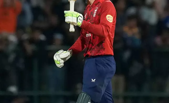England's Tom Banton celebrates his fifty runs during the second T20 cricket match between England and Sri Lanka in Pallekele, Sri Lanka, Sunday, Feb, 1. 2026. (AP Photo/Eranga Jayawardena)
