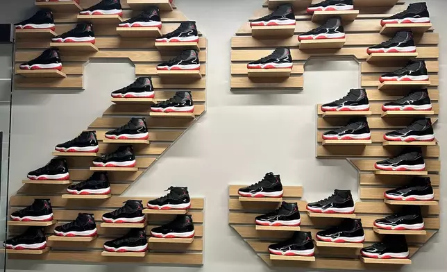 A display of 45 pairs of Nike Air Jordan 11 sneakers form the No. 23 at Airspeed, the headquarters of 23XI Racing, Tuesday, Feb. 24, 2026 in Huntersville, N.C. (AP Photo/Jenna Fryer)